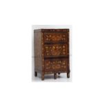 An early 19th Century Dutch walnut and floral marquetry inlaid enclosed washstand, the twin flap top