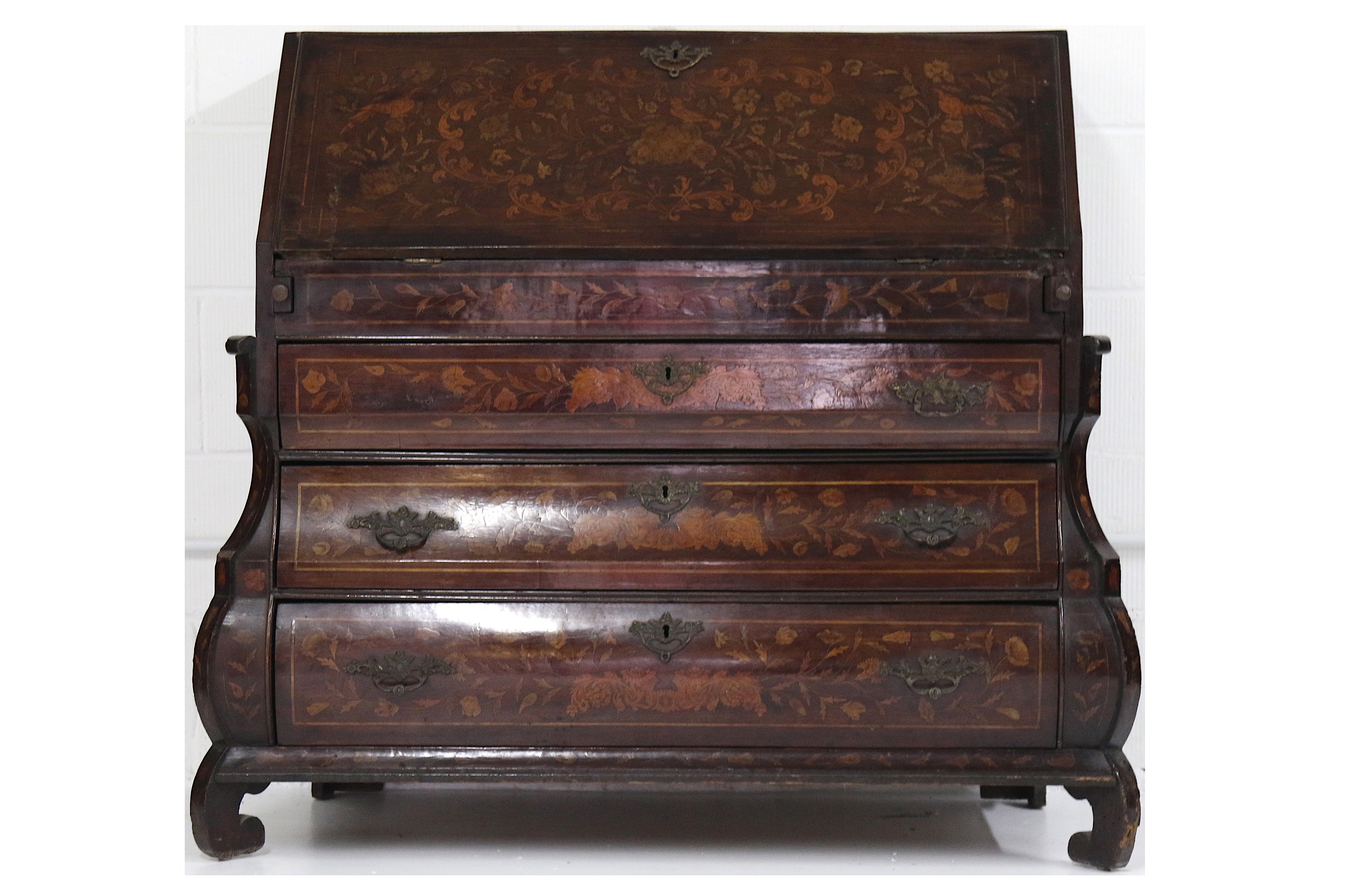 An early 19th Century Dutch walnut and floral marquetry inlaid bombe bureau, the stepped interior
