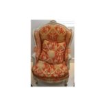 A Louis XVI design pale green painted armchair, recently reupholstered in patterned red and gold