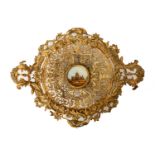 A 19th Century gilt metal circular twin handled pedestal dish with pierced C scroll and foliate