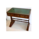 A George IV mahogany writing table, with tooled green leather top over two drawers, on solid end