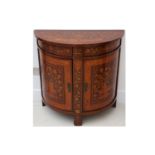 An early 20th Century Dutch mahogany floral marquetry inlaid demi-lune side cabinet, fitted with two