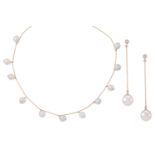 A cultured pearl necklace and earrings