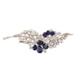 A sapphire and diamond spray brooch