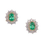 A pair of emerald and diamond earrings