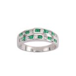 An emerald and diamond half-hoop ring