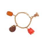 A charm bracelet The palmier-link bracelet, suspending four pendants including a carnelian fob seal,