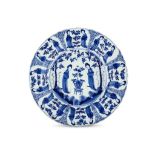 A CHINESE BLUE AND WHITE ‘LADIES’ BASIN DISH. Kangxi mark and of the period. The deep bowl with a