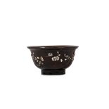 A CHINESE INLAID BLACK LACQUER BOWL. Qing, 18th Century. The rounded sides supported on a tall foot,