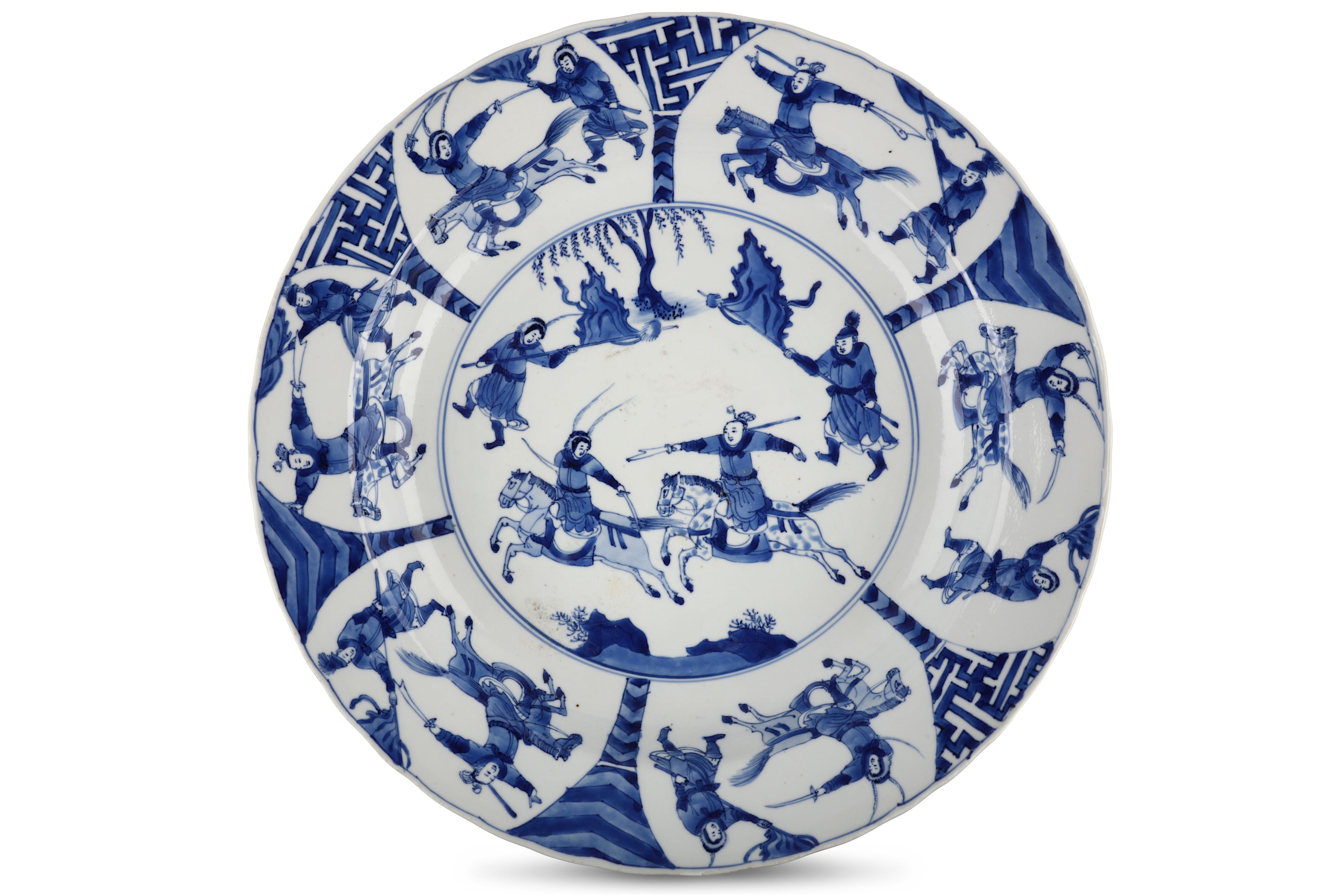 A CHINESE BLUE AND WHITE ‘WARRIORS’ BASIN DISH. Kangxi. The central roundel with warriors on