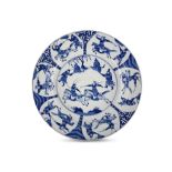 A CHINESE BLUE AND WHITE ‘WARRIORS’ BASIN DISH. Kangxi. The central roundel with warriors on