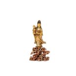 A CHINESE SOAPSTONE FIGURE OF A GUANYIN AND CHILD. Early Qing. Standing holding an infant in her