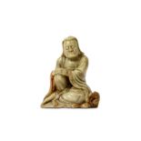 A CHINESE SOAPSTONE FIGURE OF A SEATED LOHAN. 17th century. The hands resting on the right knee