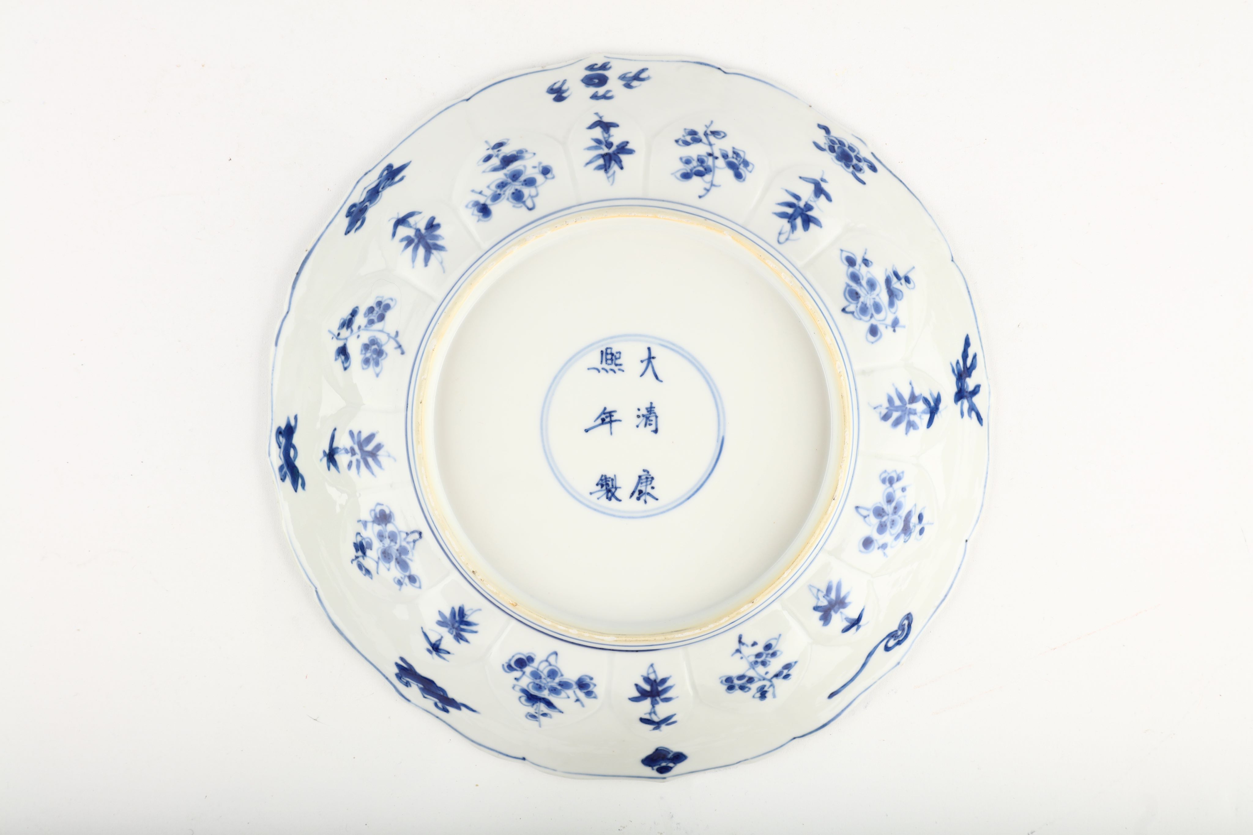 A CHINESE BLUE AND WHITE 'SCHOLAR' DISH. Kangxi mark and of the period. The central roundel painted - Image 2 of 3