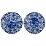 A PAIR OF CHINESE BLUE AND WHITE ‘PHOENIX ON ROCK’ DISHES. Kangxi. Each with a central roundel,