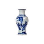 A CHINESE BLUE AND WHITE VASE. Kangxi. Of baluster form with waisted neck and flared rim, the body