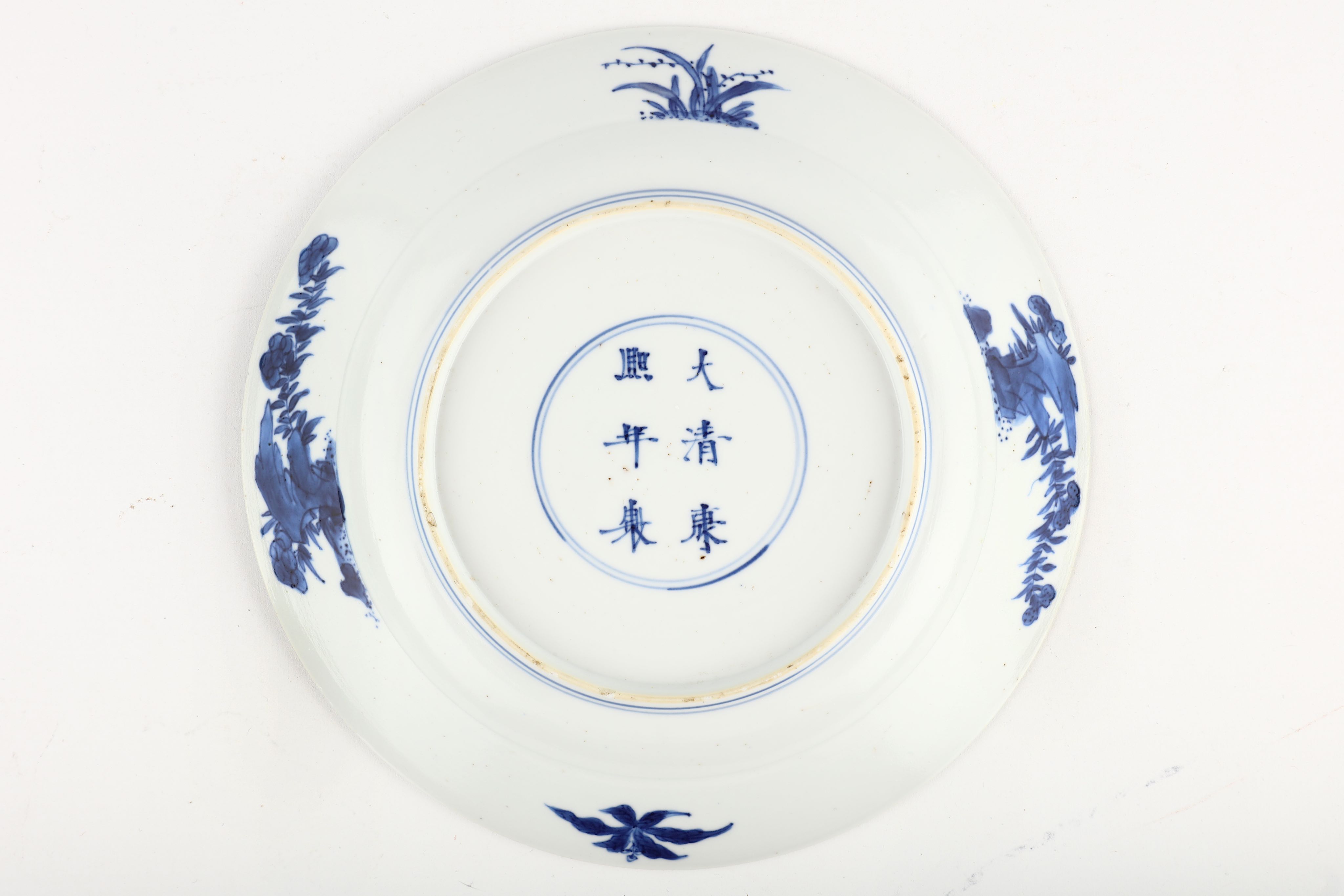 A CHINESE BLUE AND WHITE ‘MANDARIN DUCKS’ DISH. Kangxi mark and of the period. Painted with a - Image 2 of 3