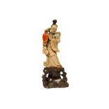 A CHINESE SOAPSTONE CARVING OF A LADY. Kangxi. Standing in long flowing robes with trailing ribbons