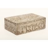 A CHINESE EXPORT SILVER BOX. Circa 1900. Of rectangular form, heavily cast, the cover modelled
