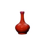 A CHINESE COPPER RED-GLAZED BOTTLE VASE. Qing Dyna