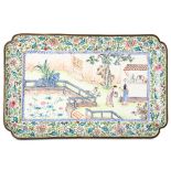 A CHINESE CANTON ENAMEL TRAY. Qing Dynasty, Qianlong era. Of rectangular form with cut corners, the