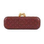 Alexander McQueen Burgundy Skull Clutch, laser cut detail revealing contrasting fuchsia leather with