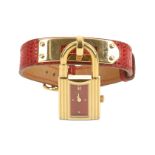 Hermes Red Lizard Kelly Watch, c. 1996, gilt metal hardware, the watch with red dial, 7mm wide, 20cm