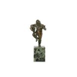 A SMALL LATE 17TH CENTURY ITALIAN BRONZE STATUETTE OF BACCHUS the bearded figure standing on his