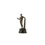 A LATE 18TH / EARLY 19TH CENTURY BRONZE STATUETTE OF APOLLO the standing nude figure with left arm