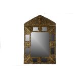 AN EARLY 18TH CENTURY FRENCH LOUIS XIV PERIOD REPOUSSE BRASS WALL MIRROR surmounted by a