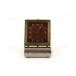 A Jaeger Le Coultre 8 day Swiss travel alarm clock, black rectangular dial with Arabic numerals