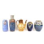 A collection of four Royal Doulton stoneware vases, including a tall baluster vase tube-line