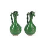 TWO LIGHT GREEN-GLAZED CANAKKALE POTTERY EWERS Ott