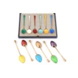 A cased set of six silver gilt and guilloche enamelled teaspoons