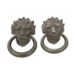 A pair of 19th Century bronze lion mask door handles or knockers, each modelled as a lions head with