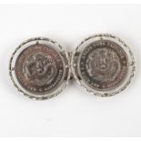 A white metal buckle set with two Chinese trade dollars, 'Kwang-Tung Province,