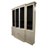 A large painted breakfront bookcase,