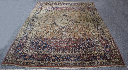 A large Kashan carpet, with abrashed field,