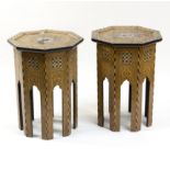 A pair of inlaid octagonal tables, each with mother-of-pearl and ebony geometric inlay,