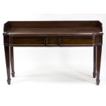 An early 19th Century mahogany serving table with three-quarter galleried top above two frieze