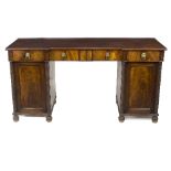 A William IV mahogany pedestal sideboard, the breakfront top fitted four frieze drawers,