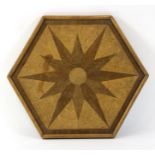 A star inlaid hexagonal tray in various woods,