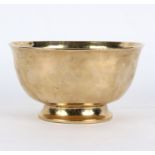 A late 17th/early 18th Century Continental brass bowl, raised on a circular foot,