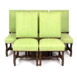 A set of five Flemish style chairs with upholstered backs and seats to a carved and moulded frame