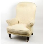 A Victorian style armchair, on turned front legs with castors/Provenance: Little Sodbury Manor,