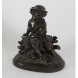 A 19th Century bronze figure of a child seated on a stump,