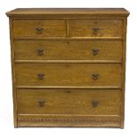 A Victorian elm chest, two short over three long drawers, with gothic style ring handles,
