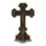 A 19th Century painted crucifix on a polished stone base, 56cm high/Provenance: Treago Castle,