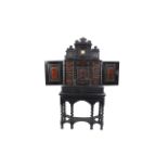 A late 17th Century ebony and faux tortoiseshell cabinet on stand, probably Antwerp,