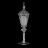 A German covered glass goblet engraved with a coat of arms, on a red and white opaque twist stem,